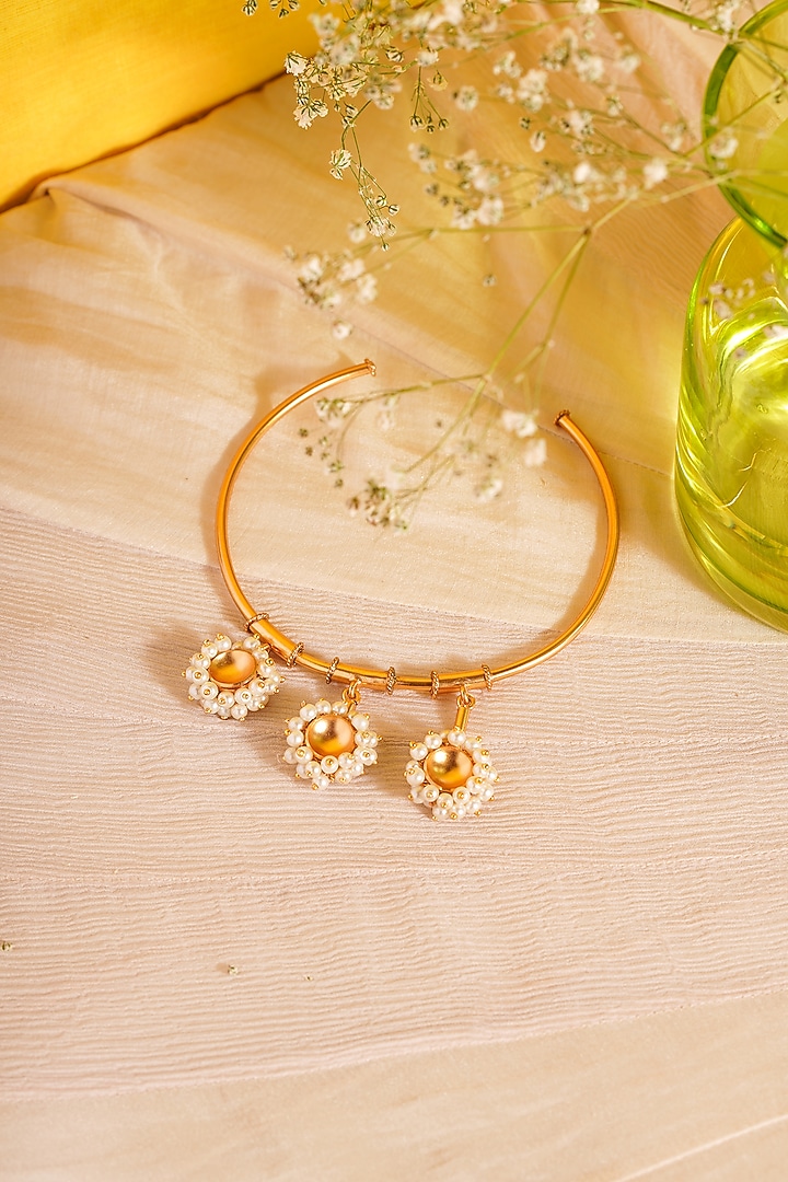 Gold Finish Pearl Hand cuff by Suhani Pittie at Pernia's Pop Up Shop