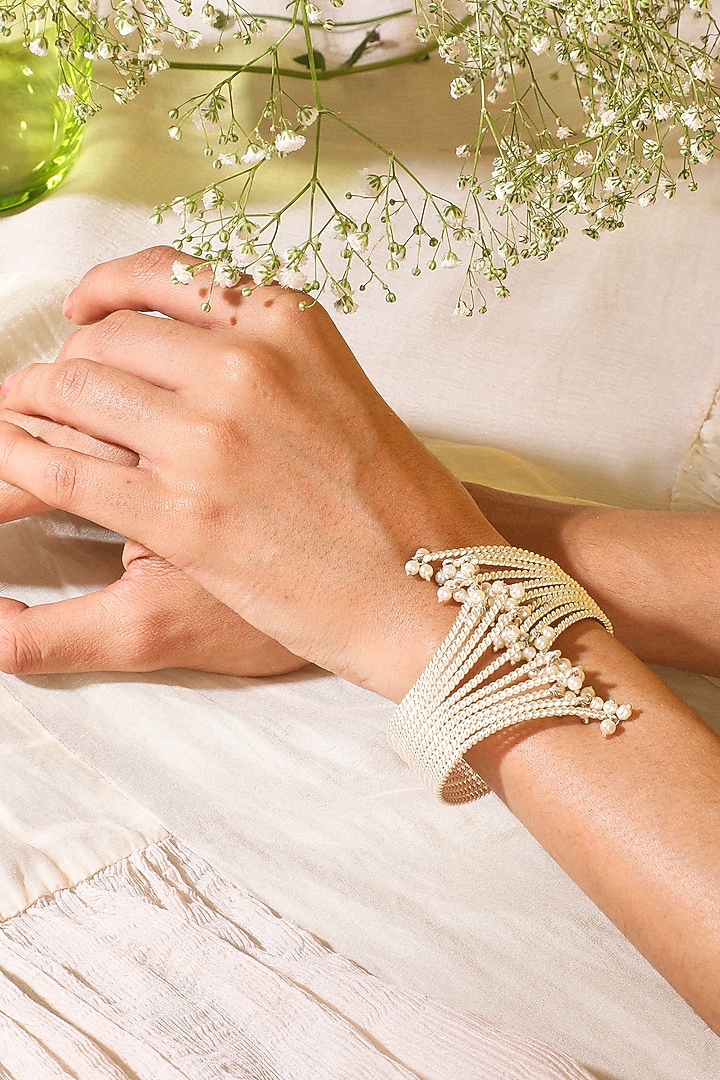 White Finish Twisted Pearl Hand Cuff by Suhani Pittie at Pernia's Pop Up Shop