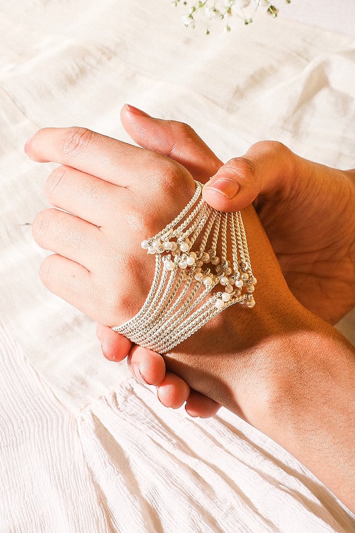 White Finish Pearl Hand Cuff by Suhani Pittie at Pernia's Pop Up Shop