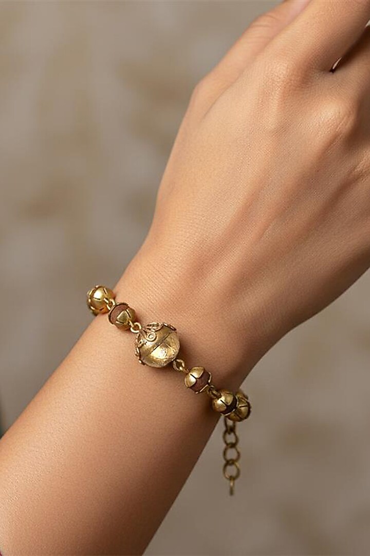 Gold Plated Wooden Beaded Floral Bracelet by Suhani Pittie at Pernia's Pop Up Shop