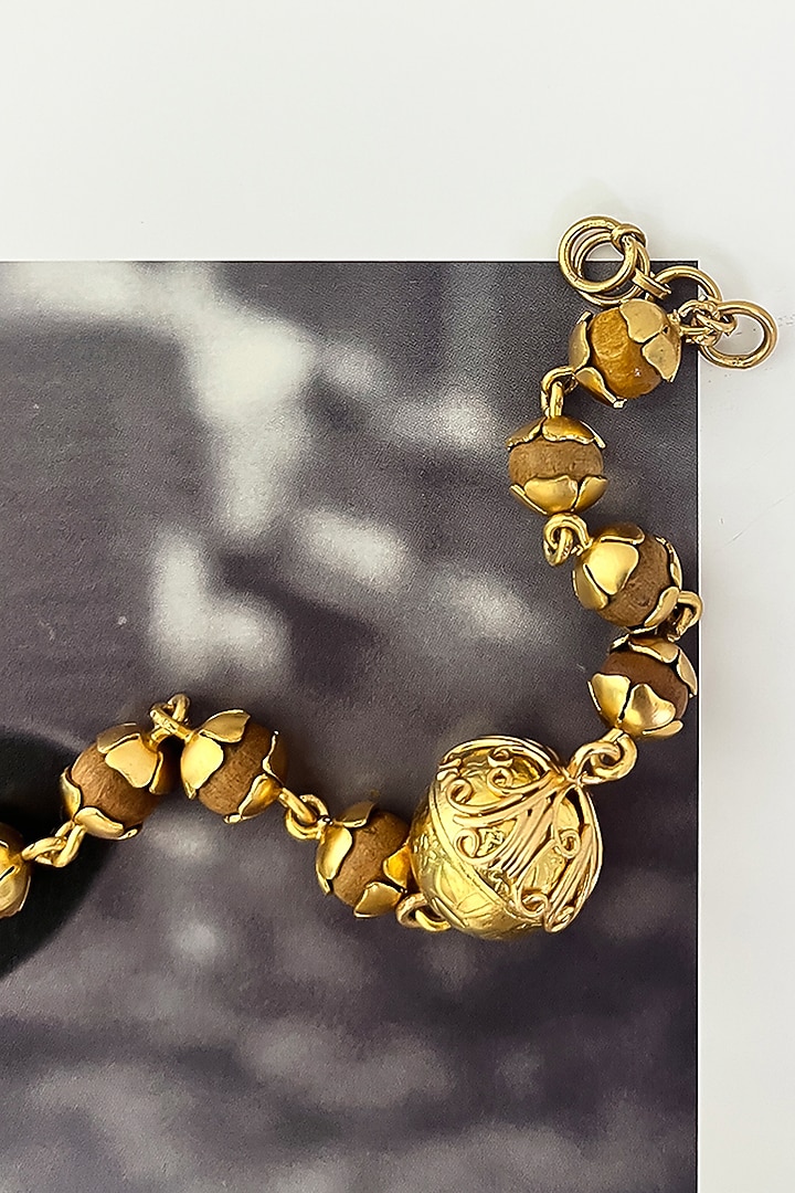Gold Plated Wooden Beaded Floral Bracelet by Suhani Pittie at Pernia's Pop Up Shop