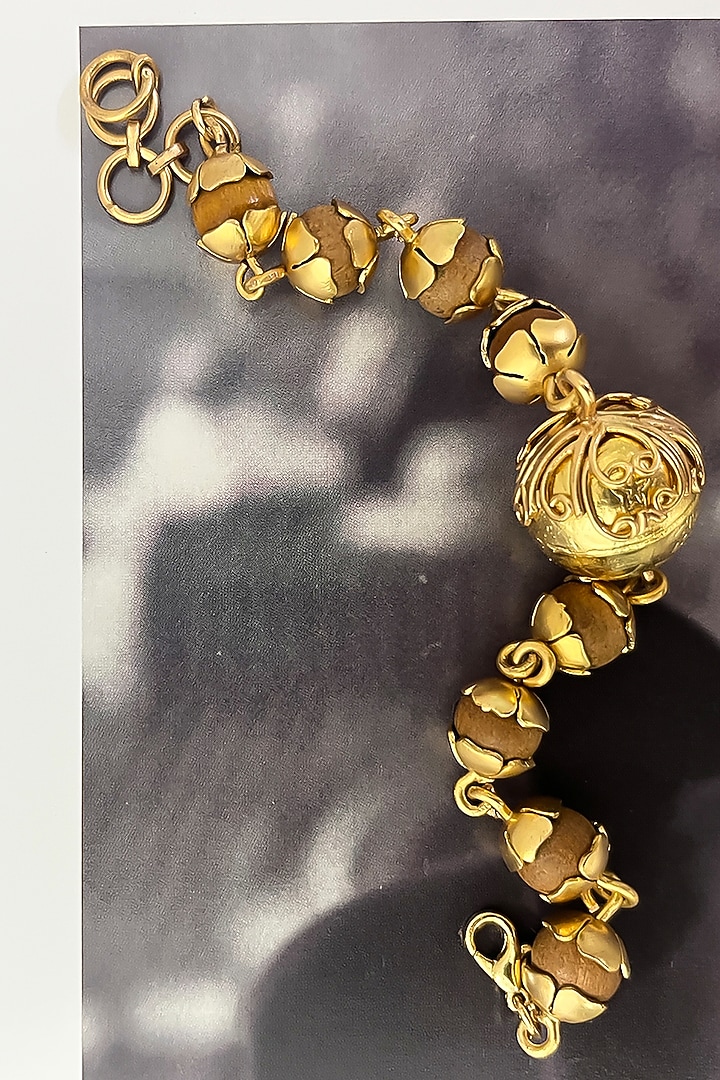 Gold Plated Wooden Beaded Floral Bracelet by Suhani Pittie at Pernia's Pop Up Shop