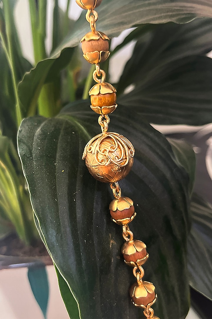 Gold Plated Wooden Beaded Floral Bracelet by Suhani Pittie at Pernia's Pop Up Shop