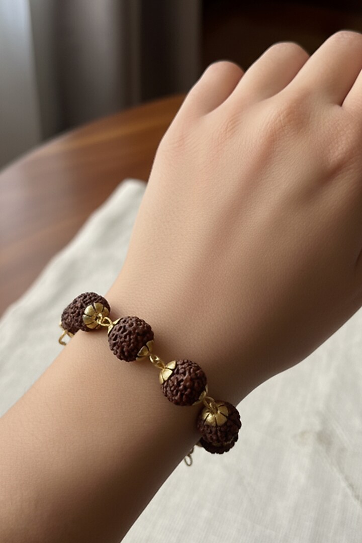 Gold Plated Rudraksha Beaded Handcrafted Bracelet by Suhani Pittie at Pernia's Pop Up Shop