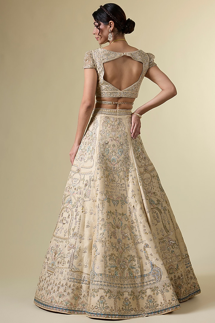 Gold Raw Silk Tribal Motif Hand & Machine Embroidered Bridal Lehenga Srt by Sulakshana Monga Couture at Pernia's Pop Up Shop