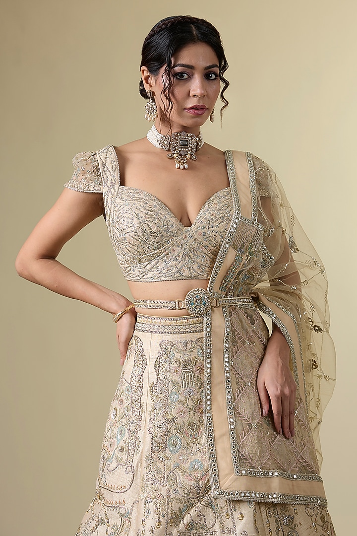Gold Raw Silk Tribal Motif Hand & Machine Embroidered Bridal Lehenga Srt by Sulakshana Monga Couture at Pernia's Pop Up Shop