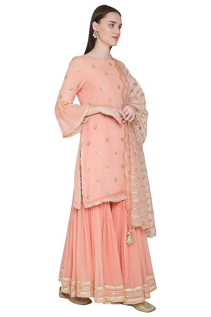 Peach Embroidered Gharara Set by Surabhi Arya at Pernia's Pop Up Shop