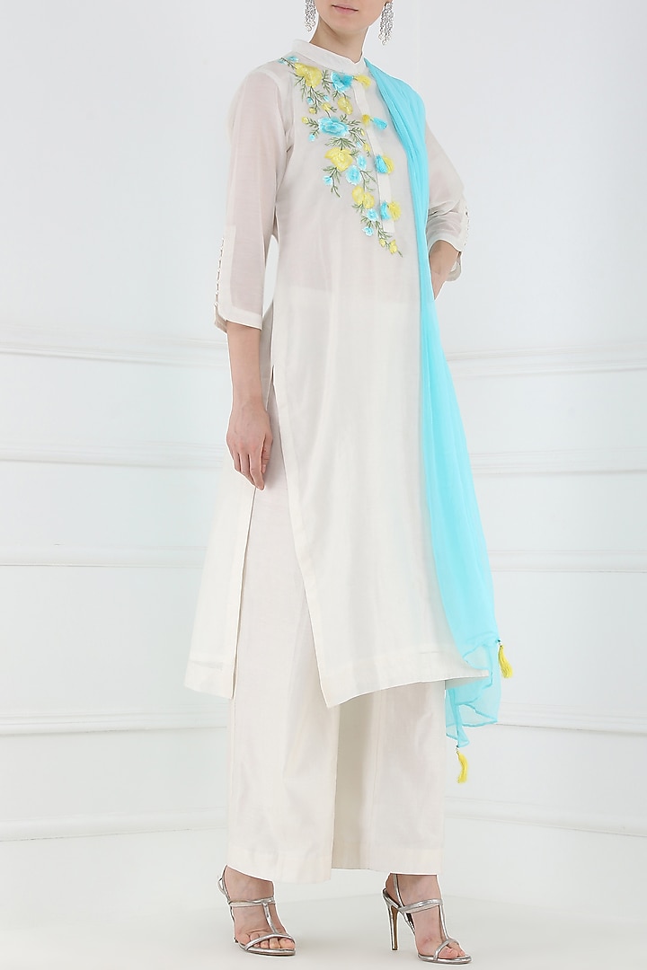 White embroidered and tassel buttons kurta and palazzo pants set available only at Pernia's Pop Up Shop.