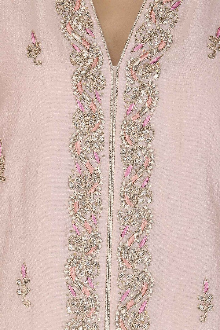 Pink hand embroided straight jacket with white skirt available only at Pernia's Pop Up Shop.
