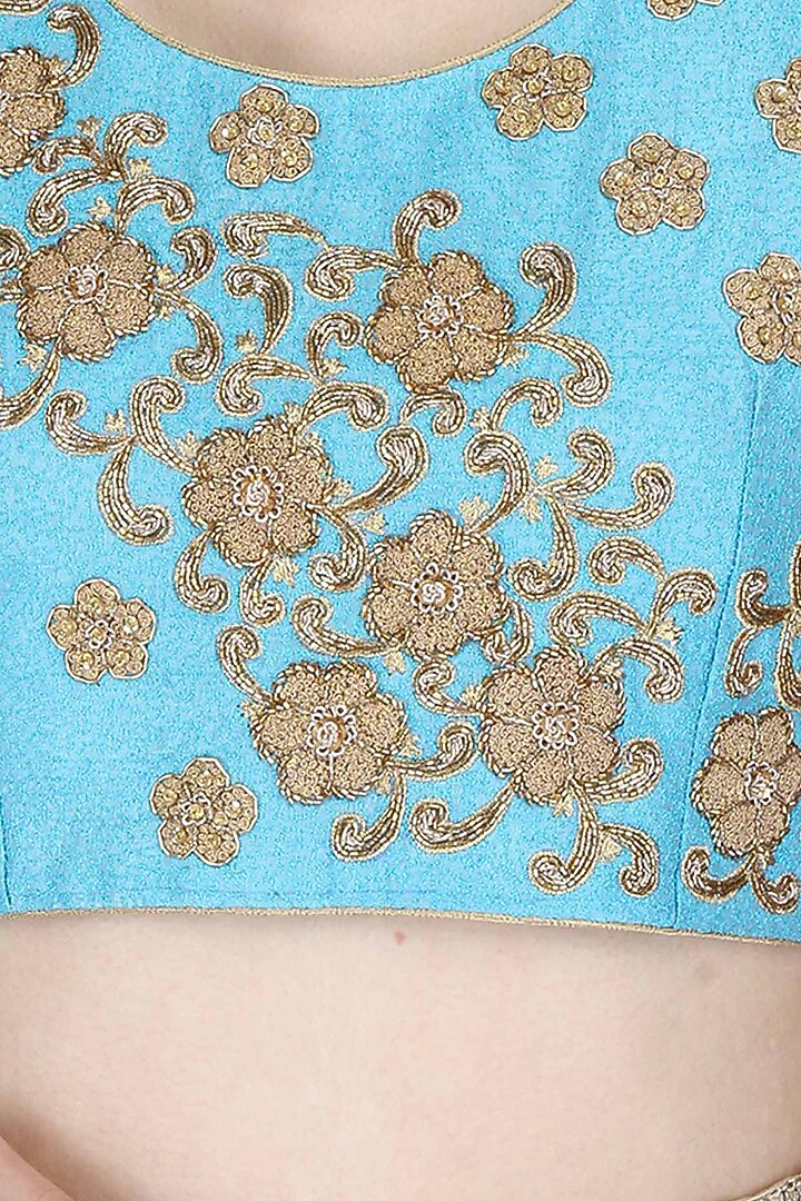 Blue sleeveless blouse with golden floral embroidered motifs available only at Pernia's Pop Up Shop.