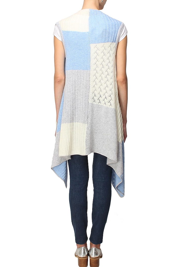 White, grey and blue intasia patchwork sleeveless cape available only at Pernia's Pop Up Shop.