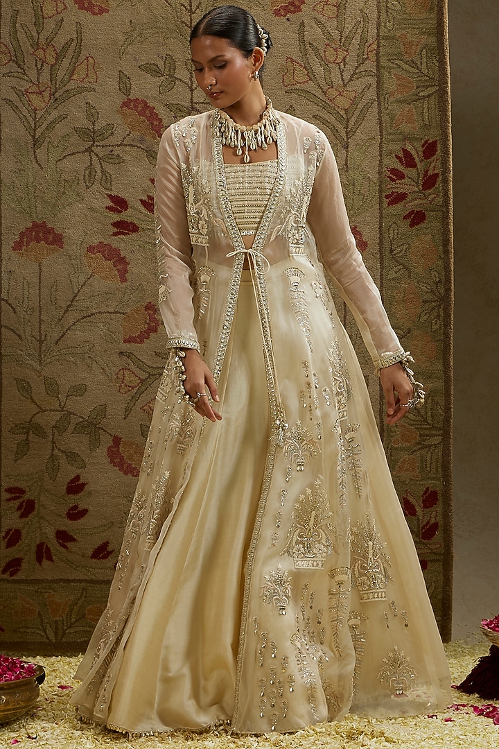 Ivory Silk Embellished Jacket Bridal Lehenga Set by SVA BY SONAM & PARAS MODI at Pernia's Pop Up Shop