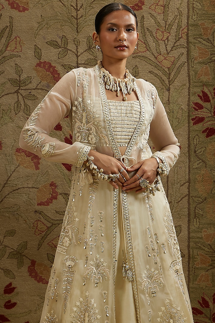 Ivory Silk Embellished Jacket Bridal Lehenga Set by SVA BY SONAM & PARAS MODI at Pernia's Pop Up Shop