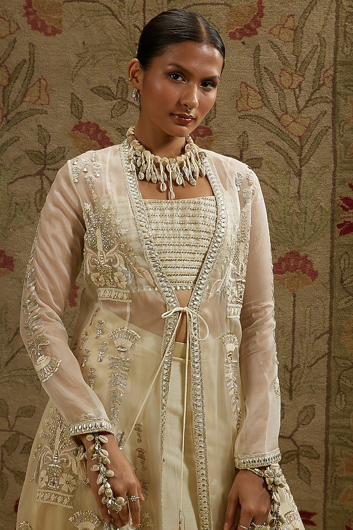Ivory Silk Embellished Jacket Bridal Lehenga Set by SVA BY SONAM & PARAS MODI at Pernia's Pop Up Shop