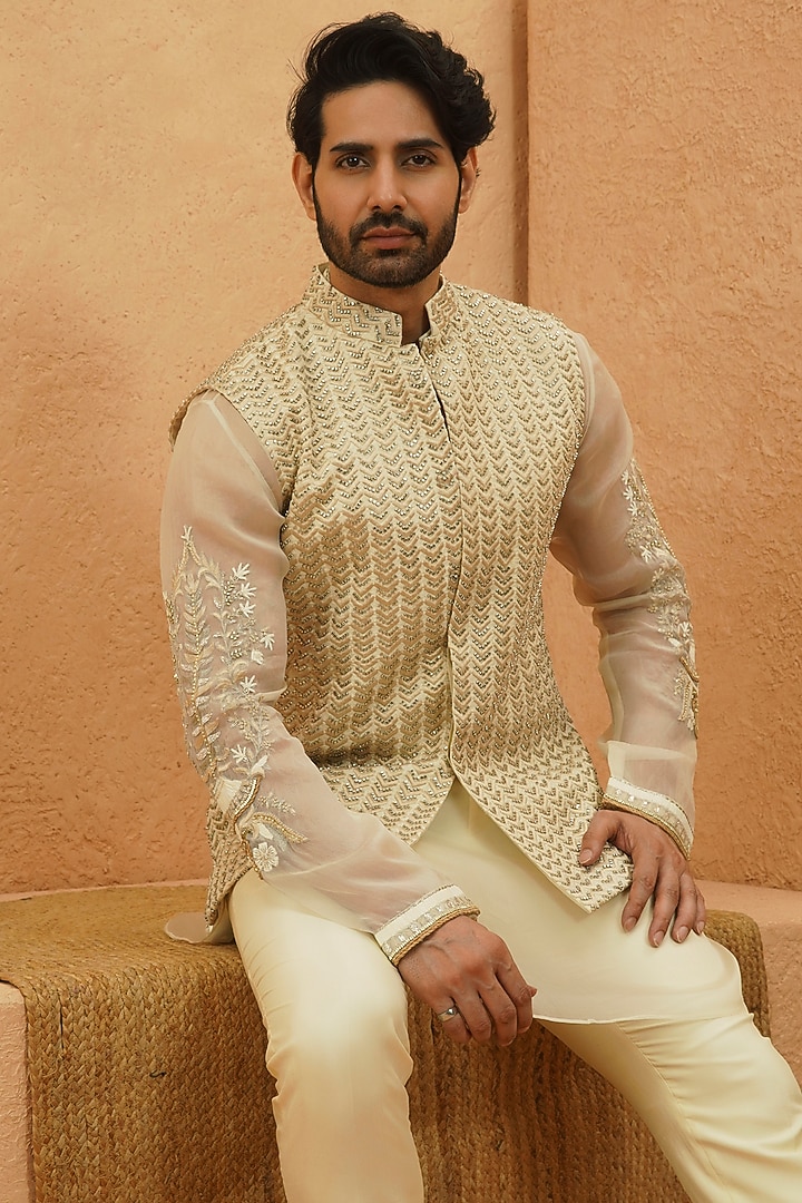 Ivory Raw Silk Chevron Embroidered Bundi Jacket by Sva By Sonam & Paras Modi Men at Pernia's Pop Up Shop