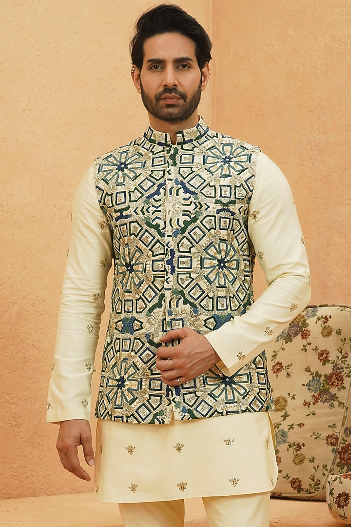 Ivory Raw Silk Geometric Embroidered Bundi Jacket by Sva By Sonam & Paras Modi Men
