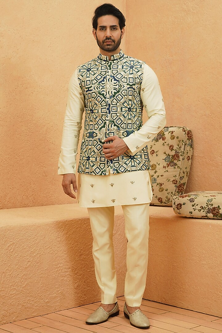 Ivory Raw Silk Geometric Embroidered Bundi Jacket by Sva By Sonam & Paras Modi Men at Pernia's Pop Up Shop
