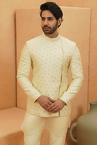 Ivory Silk Gold Embellished Asymmetric Bandhgala Jacket by Sva By Sonam & Paras Modi Men