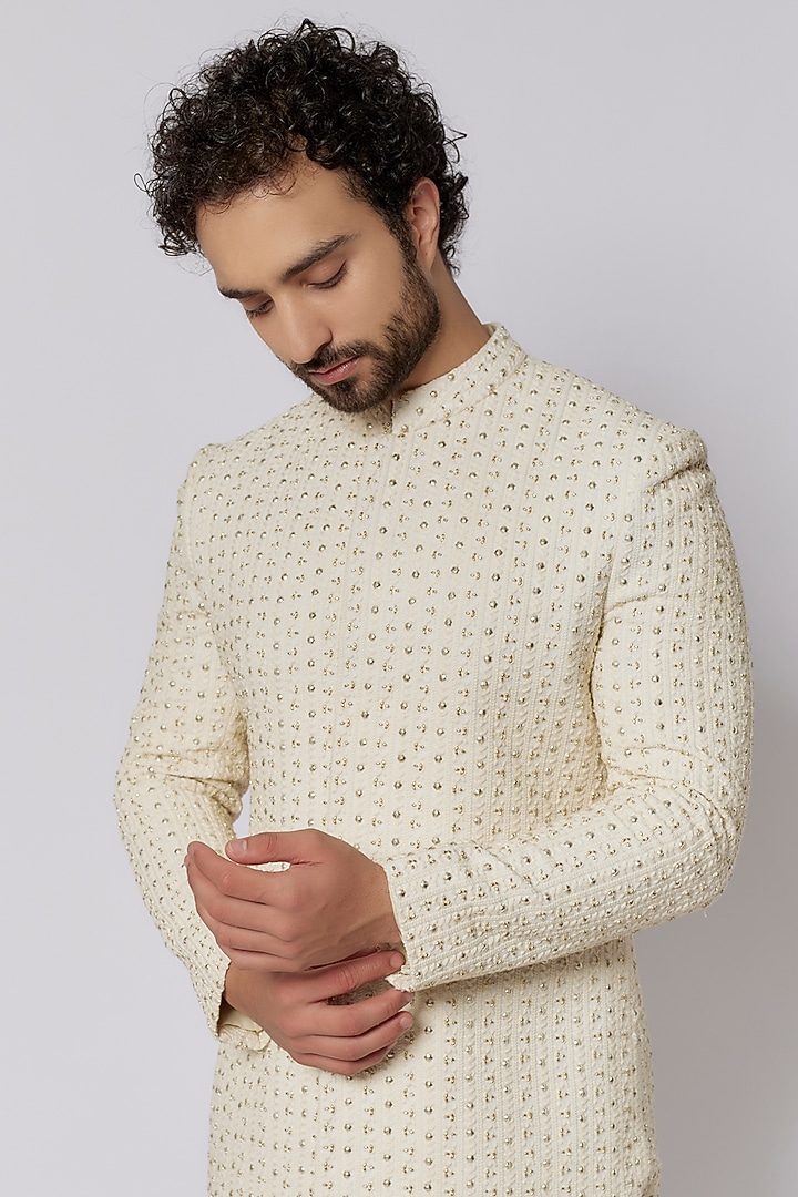 Ivory Silk Metal Embellished Groom Sherwani Set by SVA BY SONAM & PARAS MODI Men at Pernia's Pop Up Shop