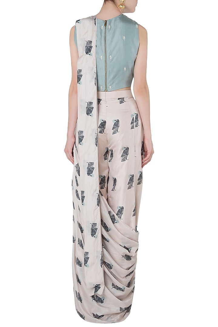 Beige printed drape saree with teal crop top available only at Pernia's Pop Up Shop.