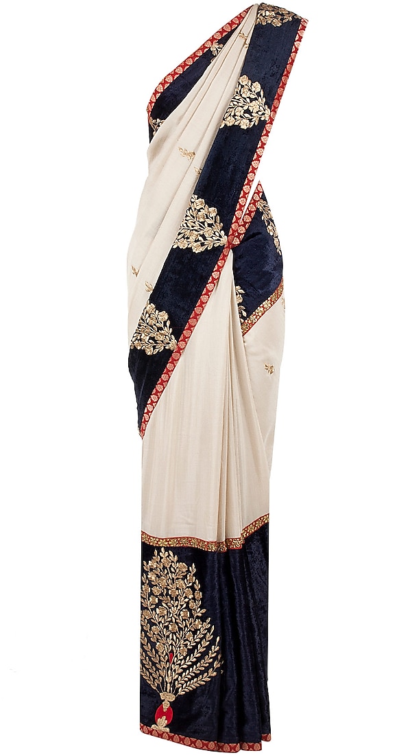 Beige and navy blue munga silk sari and gota patti blouse by SVA BY SONAM & PARAS MODI