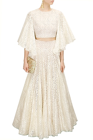 Off white cutwork peated lehenga by SVA BY SONAM & PARAS MODI