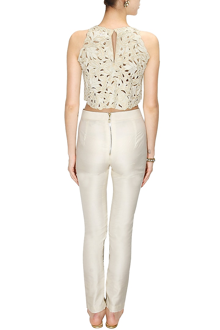 Off white floral embroidered cigarette pants available only at Pernia's Pop-Up Shop.