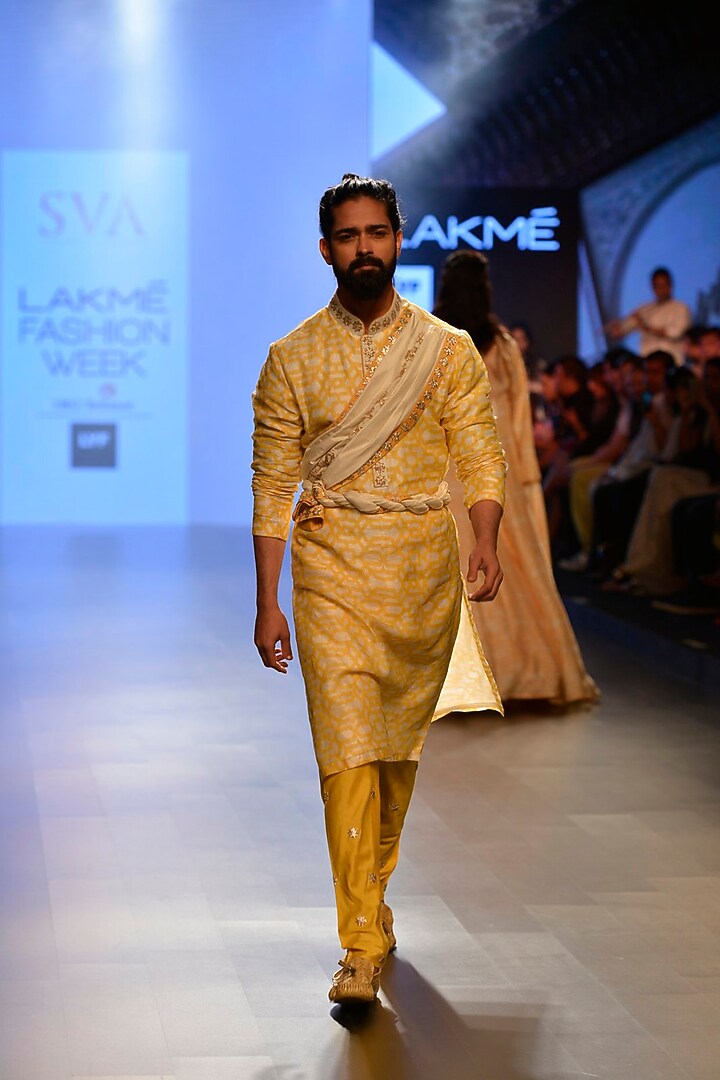 Orange geometric printed kurta with attached draped dupatta and yellow churidar available only at Pernia's Pop Up Shop.