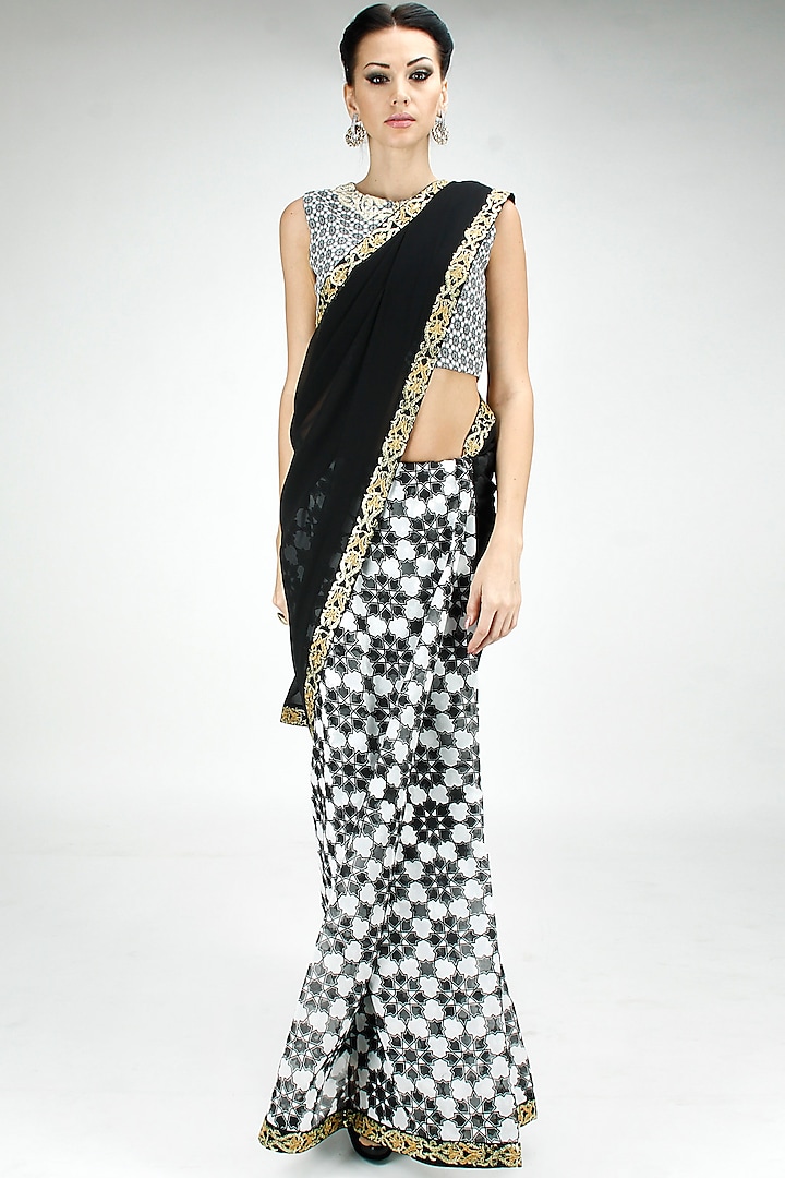 Half and half embroidered sari with black and white printed blouse by SVA BY SONAM & PARAS MODI