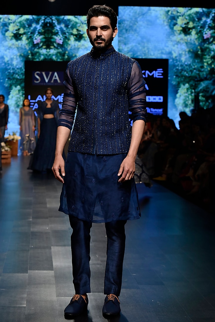 Midnight Blue Embroidered Bundi Jacket With Kurta & Pants by SVA BY SONAM & PARAS MODI Men