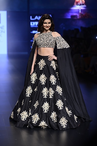 Black and Gold Floral Embroidered Cold Shoulder Cape and Lehenga Set by SVA BY SONAM & PARAS MODI