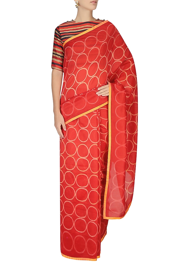 Red and yellow printed saree with black striped crop top available only at Pernia's Pop Up Shop.
