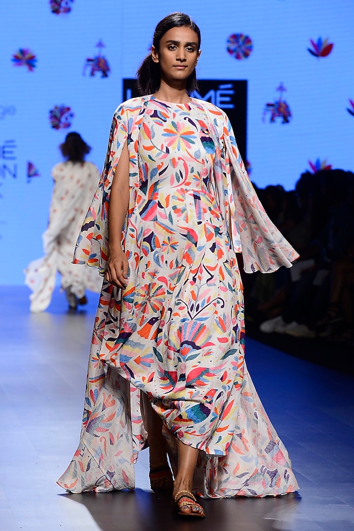 Off White Embroidered Asymmetrical Cape and Cape Set by Swati Vijaivargie