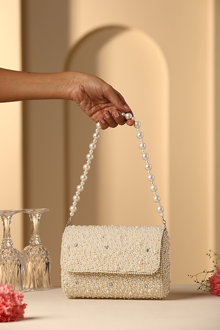 Beige Velvet Crystal & Pearl Embellished Hand Bag by SWABHIMANN ACCESSORIES at Pernia's Pop Up Shop