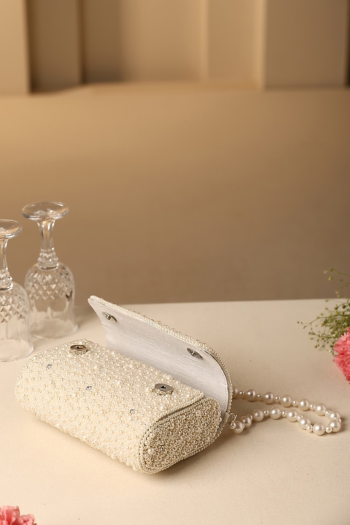 Beige Velvet Crystal & Pearl Embellished Hand Bag by SWABHIMANN ACCESSORIES at Pernia's Pop Up Shop
