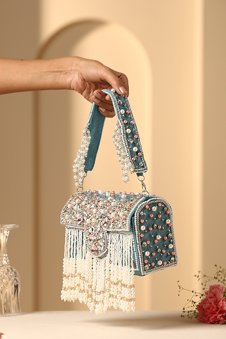 Teal Velvet Crystal & Pearl Embellished Hand Bag by SWABHIMANN ACCESSORIES at Pernia's Pop Up Shop