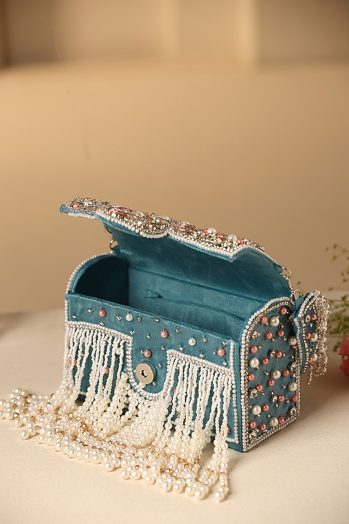 Teal Velvet Crystal & Pearl Embellished Hand Bag by SWABHIMANN ACCESSORIES at Pernia's Pop Up Shop