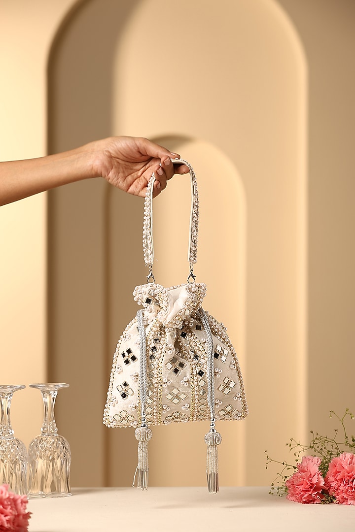 White Silk Mirror Work Potli by SWABHIMANN ACCESSORIES at Pernia's Pop Up Shop