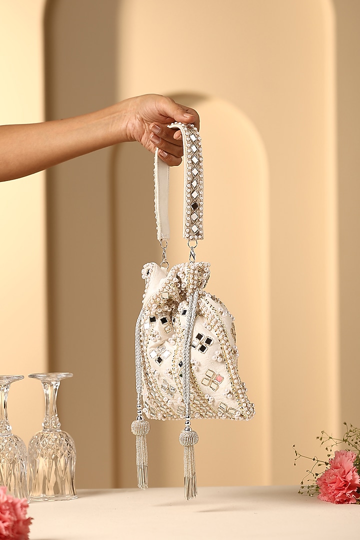 White Silk Mirror Work Potli by SWABHIMANN ACCESSORIES at Pernia's Pop Up Shop