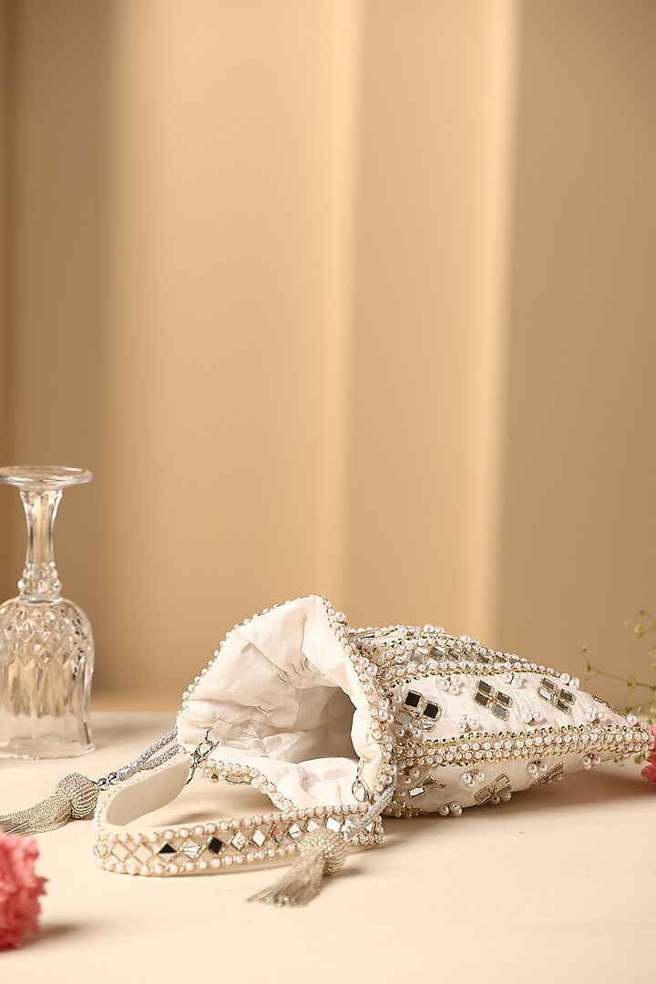 White Silk Mirror Work Potli by SWABHIMANN ACCESSORIES at Pernia's Pop Up Shop