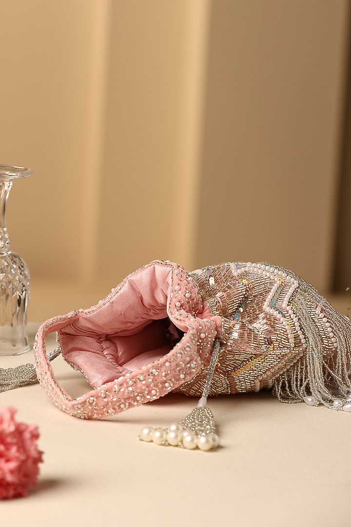 Pink Velvet Pearl & Nalki Bead Work Potli by SWABHIMANN ACCESSORIES at Pernia's Pop Up Shop