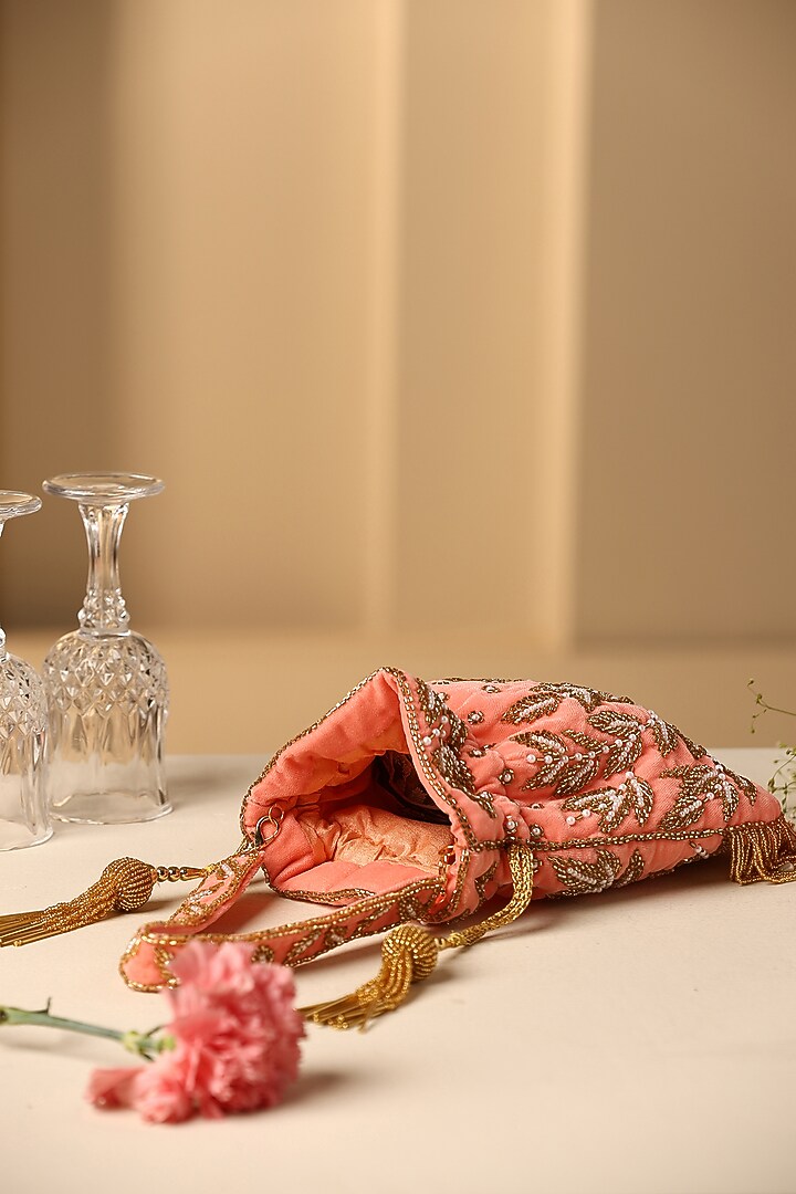 Peach Velvet Sequins & Pearl Embroidered Potli by SWABHIMANN ACCESSORIES at Pernia's Pop Up Shop