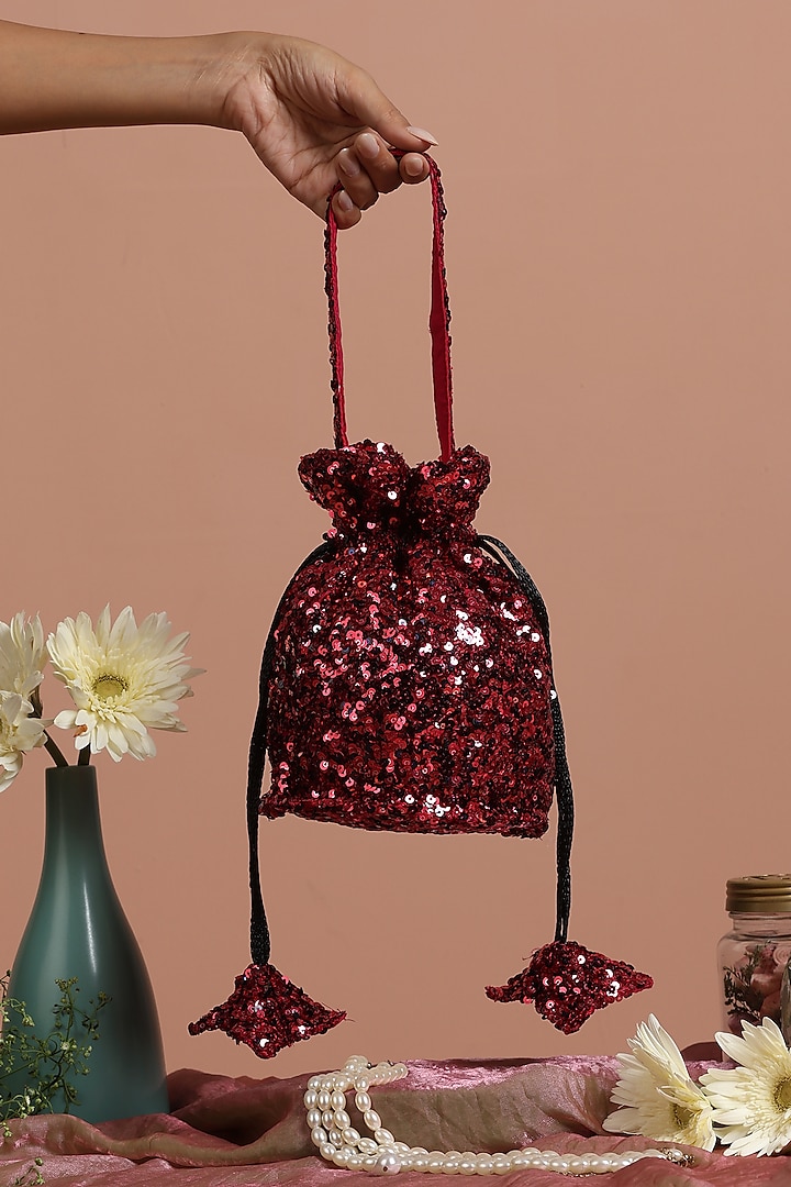 Maroon Sequins Net Potli Bag by SWABHIMANN ACCESSORIES at Pernia's Pop Up Shop