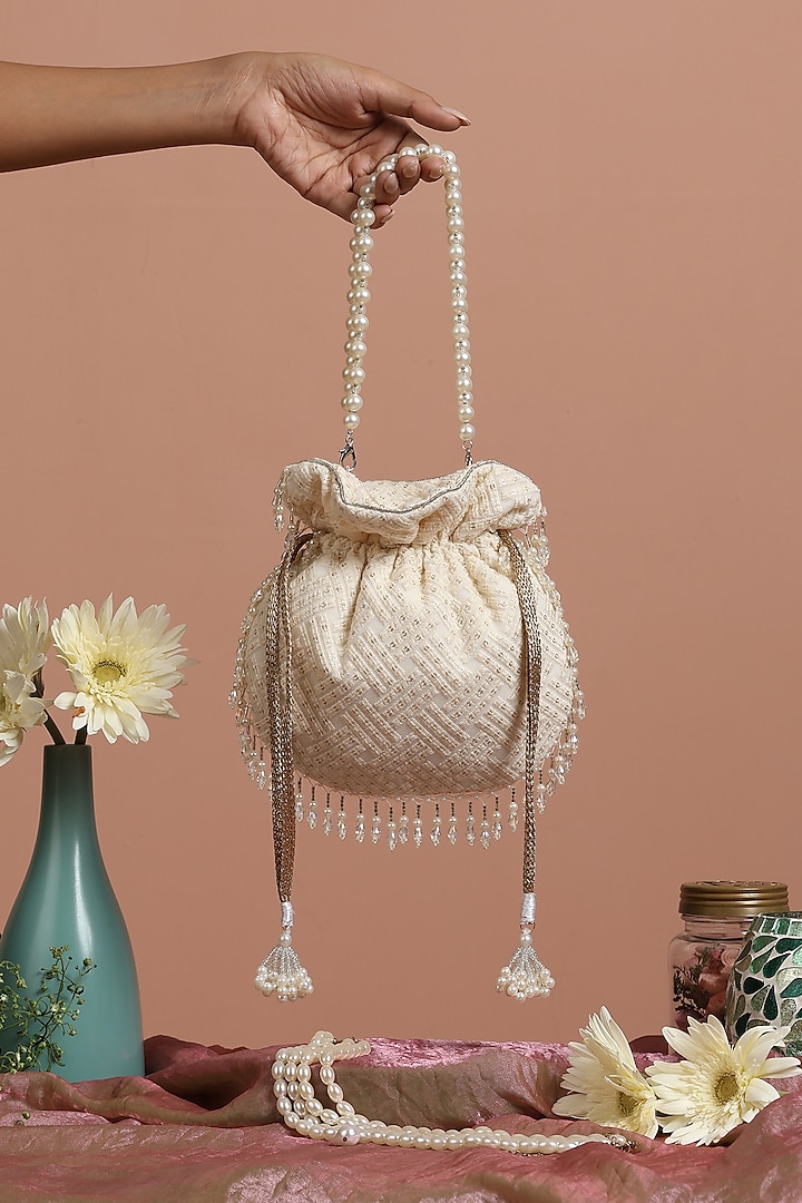 White Silk Sequins Potli Bag by SWABHIMANN ACCESSORIES at Pernia's Pop Up Shop