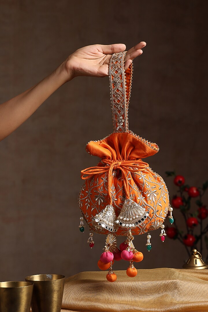 Orange Chanderi Embroidered Potli Bag by SWABHIMANN ACCESSORIES at Pernia's Pop Up Shop