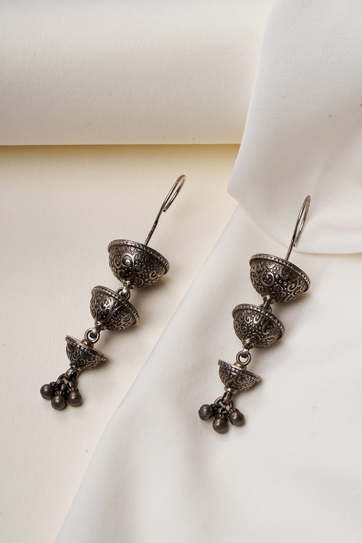 Oxidised Silver Finish Textured Layered Hook Earrings In Sterling Silver by Swadeshi Pitara at Pernia's Pop Up Shop