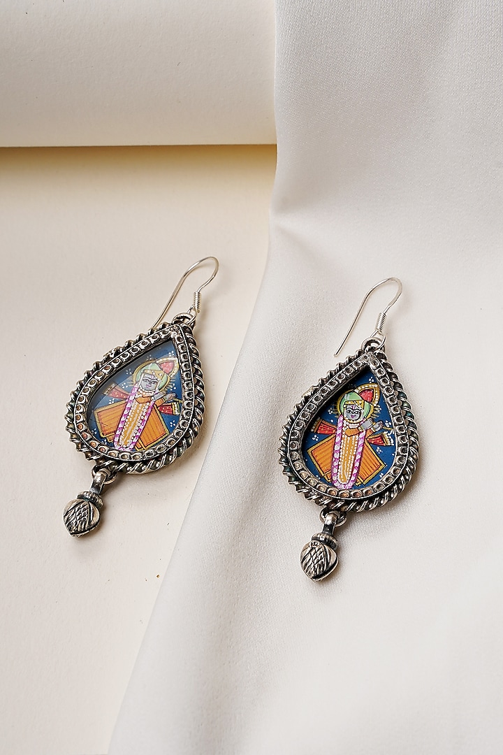 Oxidised Silver Finish Handpainted Shreenathji Dangler Earrings In Sterling Silver by Swadeshi Pitara at Pernia's Pop Up Shop