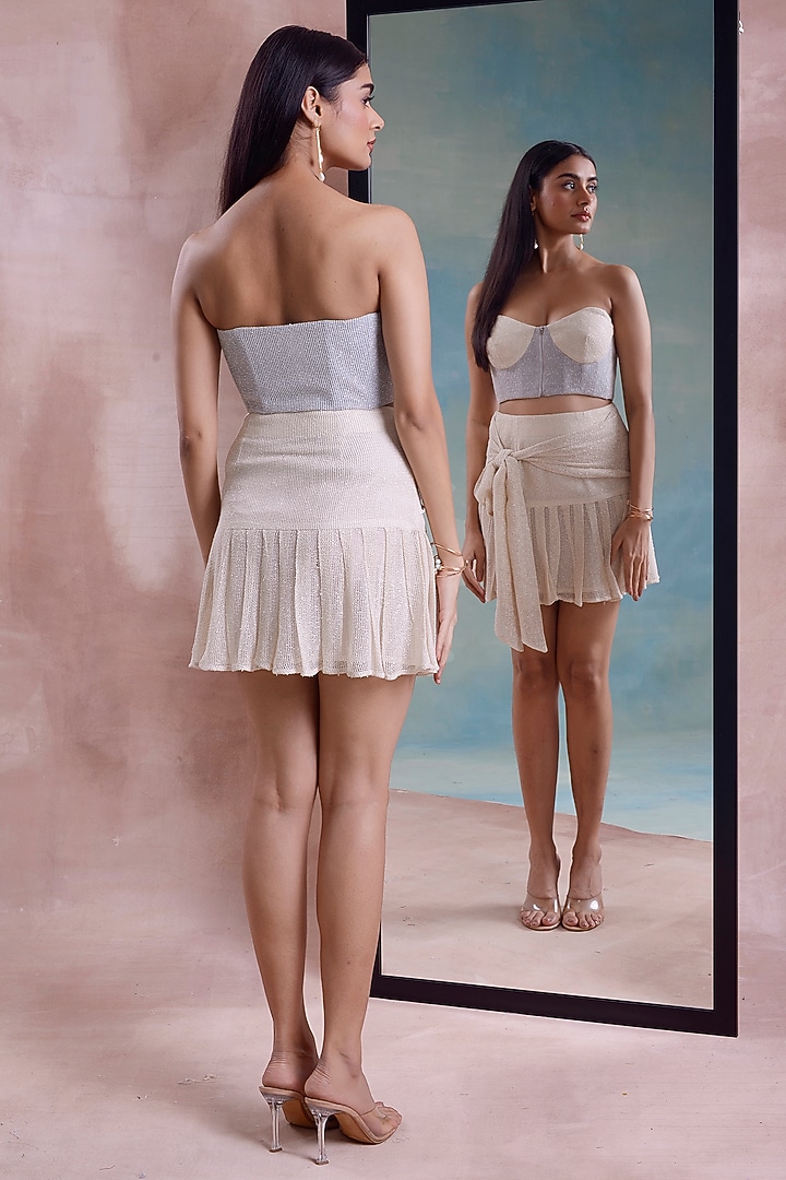 Ivory Mesh Pleated Mini Skirt Set by Shwetanga at Pernia's Pop Up Shop