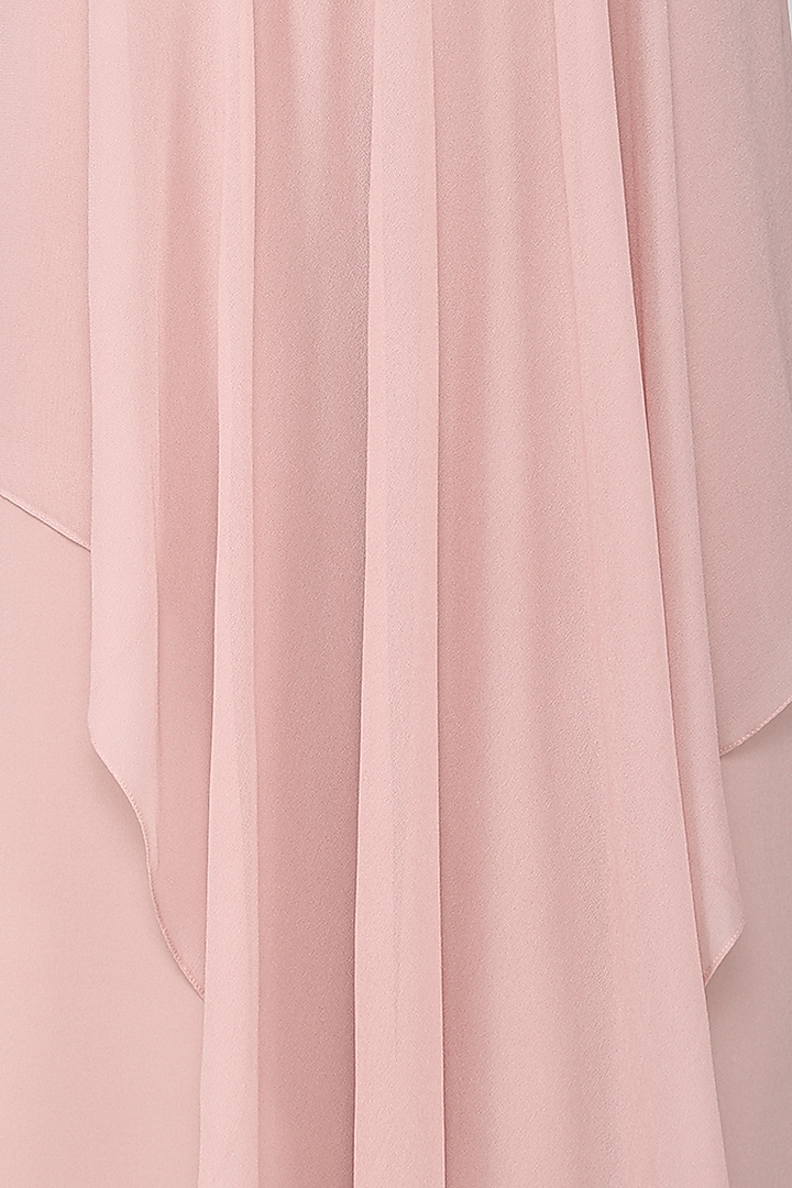 Blush pink asymmetrical jumpsuit available only at Pernia's Pop Up Shop.