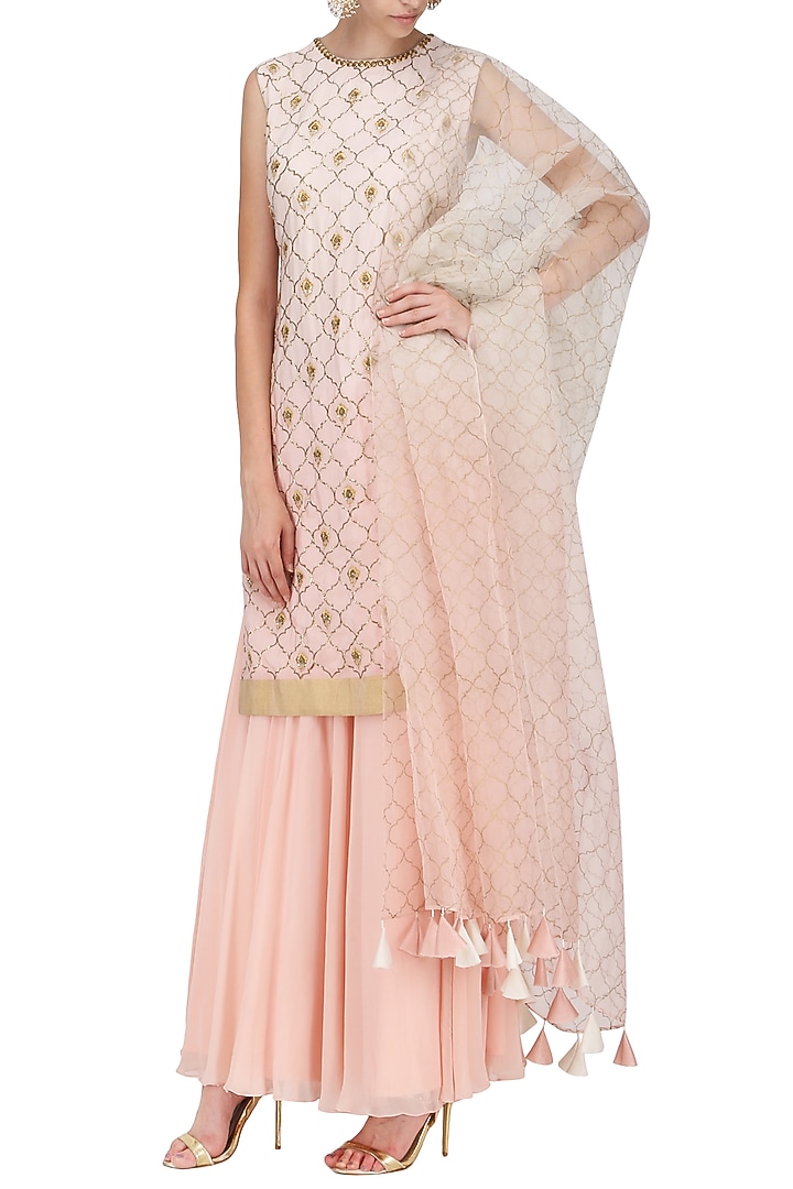A peach crepe stright suit with skirt and dupatta available only at Pernia's Pop Up Shop.